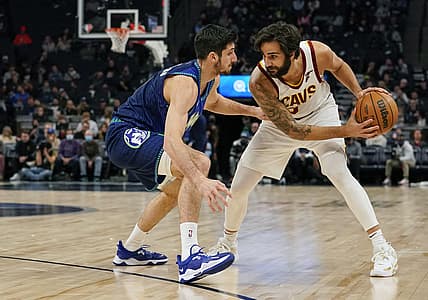 Dec 10, 2021; Minneapolis, Minnesota, USA;  Cleveland Cavaliers guard Ricky Rubio (3) controls the ball as Minnesota Timberwolves guard Leandro Bolmaro (9) defends during the first quarter at Target Center. Mandatory Credit: Nick Wosika-USA TODAY Sports