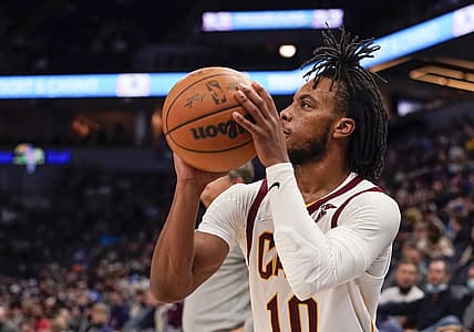Dec 10, 2021; Minneapolis, Minnesota, USA;  Cleveland Cavaliers guard Darius Garland (10) hits a three-pointer against the Minnesota Timberwolves during the fourth quarter at Target Center. Mandatory Credit: Nick Wosika-USA TODAY Sports