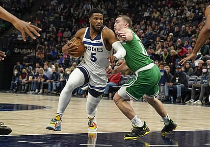Dec 27, 2021; Minneapolis, Minnesota, USA; Minnesota Timberwolves guard Malik Beasley (5) drives to the basket as Boston Celtics guard Payton Pritchard (11) defends during the second quarter at Target Center. Mandatory Credit: Nick Wosika-USA TODAY Sports