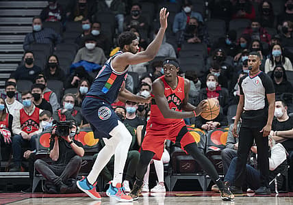 Dec 28, 2021; Toronto, Ontario, CAN; Toronto Raptors forward Pascal Siakam (43) controls the ball as Philadelphia 76ers center Joel Embiid (21) tries to defend during the second quarter at Scotiabank Arena. Mandatory Credit: Nick Turchiaro-USA TODAY Sports