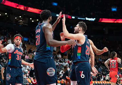 Dec 28, 2021; Toronto, Ontario, CAN; Philadelphia 76ers center Joel Embiid (21) celebrates the win with Philadelphia 76ers forward Georges Niang (20) at the end of the fourth quarter against the Toronto Raptors at Scotiabank Arena. Mandatory Credit: Nick Turchiaro-USA TODAY Sports
