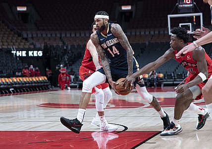 Jan 9, 2022; Toronto, Ontario, CAN; New Orleans Pelicans forward Brandon Ingram (14) drives to the basket as Toronto Raptors forward OG Anunoby (3) tries to defend during the third quarter at Scotiabank Arena. Mandatory Credit: Nick Turchiaro-USA TODAY Sports