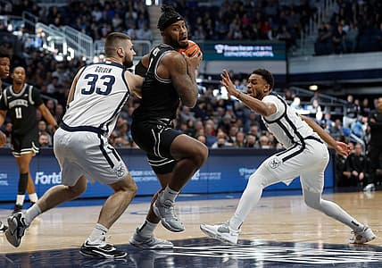 Butler Bulldogs forward Bryce Golden (33) and Butler guard Aaron Thompson (2) surround Providence Friars center Nate Watson (0) during the first half of the game Sunday, Feb. 20, 2022, at Hinkle Fieldhouse in Indianapolis. Providence edged Butler in overtime for the win, 71-70.

Butler Bulldogs Versus Providence Friars On Sunday Feb 20 2022 At Hinkle Fieldhouse In Indianapolis