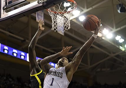 Mar 3, 2022; Seattle, Washington, USA; Washington Huskies forward Nate Roberts (1) shoots the ball over Oregon Ducks center Franck Kepnang (22) during the first half at Alaska Airlines Arena at Hec Edmundson Pavilion. Mandatory Credit: Stephen Brashear-USA TODAY Sports