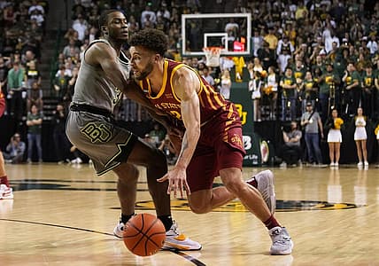 Mar 5, 2022; Waco, Texas, USA; Iowa State Cyclones guard Gabe Kalscheur (22) drives on Baylor Bears guard Dale Bonner (3) during the first half at Ferrell Center. Mandatory Credit: Raymond Carlin III-USA TODAY Sports