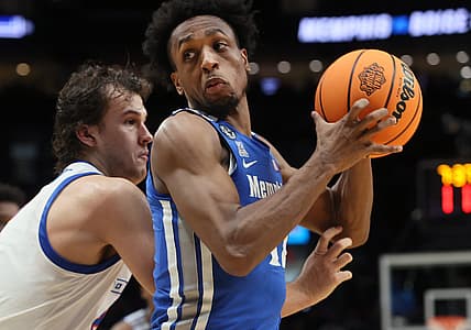 Memphis Tigers forward DeAndre Williams spins past Boise State Broncos forward Tyson Degenhart during their first round NCAA Tournament matchup on Thursday, March 17, 2022 at the Moda Center in Portland, Ore.

Jrca1602
