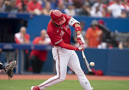 Jul 1, 2022; Toronto, Ontario, CAN; Toronto Blue Jays designated hitter Lourdes Gurriel Jr. (13) hits a double against the Tampa Bay Rays during the third inning at Rogers Centre. Mandatory Credit: Nick Turchiaro-USA TODAY Sports