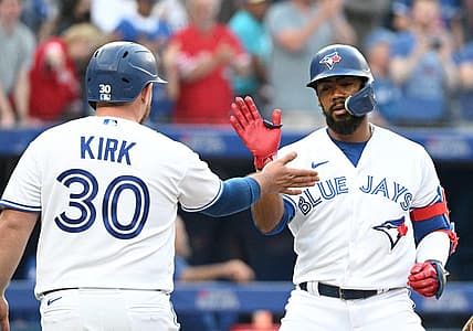 Jul 13, 2022; Toronto, Ontario, CAN; Toronto Blue Jays right fielder Teoscar Hernandez (right) is greeted at home plate by catcher Alejandro Kirk (30) after hitting a two-run home run against the Philadelphia Phillies in the fourth inning at Rogers Centre. Mandatory Credit: Dan Hamilton-USA TODAY Sports