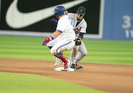 Jul 28, 2022; Toronto, Ontario, CAN; Toronto Blue Jays designated hitter Alejandro Kirk (30) slides into second base safe ahead of the tag from Detroit Tigers shortstop Javier Baez (28) during the seventh inning at Rogers Centre. Mandatory Credit: Nick Turchiaro-USA TODAY Sports