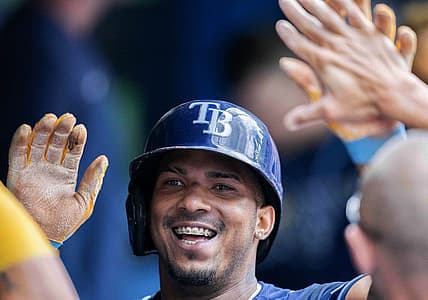 Jul 2, 2022; Toronto, Ontario, CAN; Tampa Bay Rays shortstop Wander Franco (5) celebrates in the dugout after hitting a home run against the Toronto Blue Jays during the sixth inning at Rogers Centre. Mandatory Credit: Nick Turchiaro-USA TODAY Sports