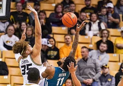 Nov 23, 2022; Columbia, Missouri, USA; Coastal Carolina Chanticleers guard Jomaru Brown (11) shoots a layup as Missouri Tigers forward Noah Carter (35) defends during the first half at Mizzou Arena. Mandatory Credit: Denny Medley-USA TODAY Sports