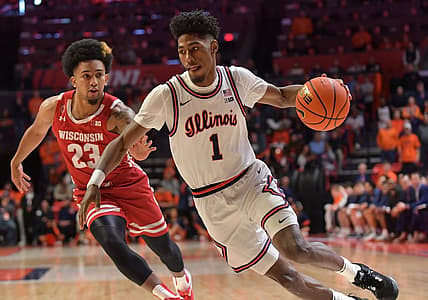 Jan 7, 2023; Champaign, Illinois, USA;  Illinois Fighting Illini guard Sencire Harris (1) drives the ball past Wisconsin Badgers guard Chucky Hepburn (23) during the first half at State Farm Center. Mandatory Credit: Ron Johnson-USA TODAY Sports