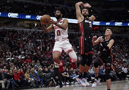 Mar 18, 2023; Chicago, Illinois, USA; Miami Heat guard Max Strus (31) defends Chicago Bulls guard Coby White (0) during the first half at United Center. Mandatory Credit: David Banks-USA TODAY Sports