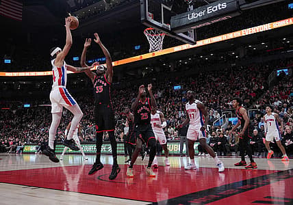 Mar 24, 2023; Toronto, Ontario, CAN; Detroit Pistons guard R.J. Hampton (14) drives to the basket as Toronto Raptors center Christian Koloko (35) tries to defend during the second quarter at Scotiabank Arena. Mandatory Credit: Nick Turchiaro-USA TODAY Sports