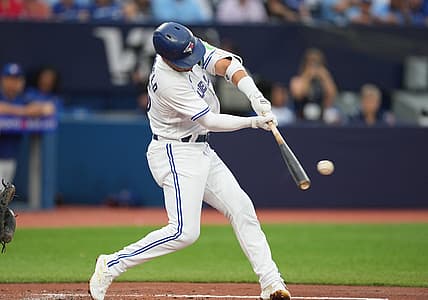Jul 28, 2023; Toronto, Ontario, CAN; Toronto Blue Jays second baseman Whit Merrifield (15) hits a single against the Los Angeles Angels during the third inning at Rogers Centre. Mandatory Credit: Nick Turchiaro-USA TODAY Sports