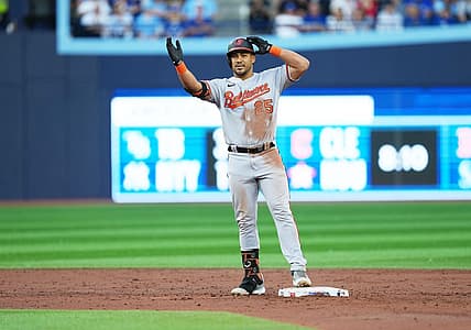 Jul 31, 2023; Toronto, Ontario, CAN; Baltimore Orioles right fielder Anthony Santander (25) celebrates hitting a double against the Toronto Blue Jays during the third inning at Rogers Centre. Mandatory Credit: Nick Turchiaro-USA TODAY Sports