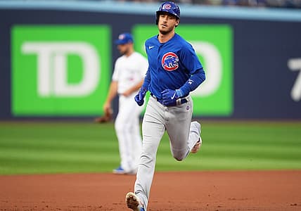 Aug 11, 2023; Toronto, Ontario, CAN; Chicago Cubs first baseman Cody Bellinger (24) runs the bases after hitting a two run home run against the Toronto Blue Jays during the first inning at Rogers Centre. Mandatory Credit: Nick Turchiaro-USA TODAY Sports