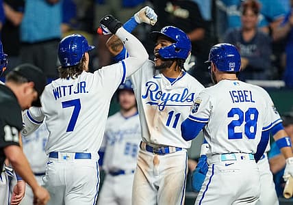 Aug 15, 2023; Kansas City, Missouri, USA; Kansas City Royals shortstop Bobby Witt Jr. (7) is congratulated by third baseman Maikel Garcia (11) and center fielder Kyle Isbel (28) after hitting a grand slam during the fifth inning against the Seattle Mariners at Kauffman Stadium. Mandatory Credit: Jay Biggerstaff-USA TODAY Sports