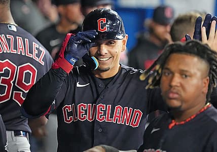 Aug 25, 2023; Toronto, Ontario, CAN; Cleveland Guardians second baseman Andres Gimenez (0) celebrates in the dugout after hitting a home run against the Toronto Blue Jays during the eighth inning at Rogers Centre. Mandatory Credit: Nick Turchiaro-USA TODAY Sports