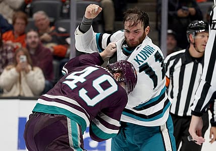 Nov 12, 2023; Anaheim, California, USA; San Jose Sharks center Luke Kunin (11) and Anaheim Ducks left wing Max Jones (49) fight during the second period at Honda Center. Mandatory Credit: Jason Parkhurst-USA TODAY Sports