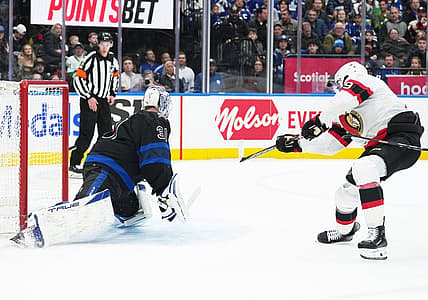 Dec 27, 2023; Toronto, Ontario, CAN; Ottawa Senators right wing Drake Batherson (19) scores a goal onf Toronto Maple Leafs goaltender Martin Jones (31) during the second period at Scotiabank Arena. Mandatory Credit: Nick Turchiaro-USA TODAY Sports