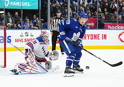 Dec 19, 2023; Toronto, Ontario, CAN; Toronto Maple Leafs left wing Tyler Bertuzzi (59) battles for the puck in front of  New York Rangers goaltender Igor Shesterkin (31) during the third period at Scotiabank Arena. Mandatory Credit: Nick Turchiaro-USA TODAY Sports