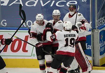 Feb 15, 2021; Toronto, Ontario, CAN; Ottawa Senators right wing Evgenii Dadonov (63) celebrates with center Josh Norris (9) after scoring a goal against the Toronto Maple Leafs during the overtime period at Scotiabank Arena. Mandatory Credit: Nick Turchiaro-USA TODAY Sports