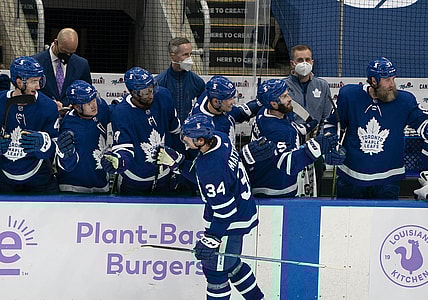 Apr 10, 2021; Toronto, Ontario, CAN; Toronto Maple Leafs center Auston Matthews (34) celebrates at the bench after scoring a third goal against the Ottawa Senators during the second period at Scotiabank Arena. Mandatory Credit: Nick Turchiaro-USA TODAY Sports