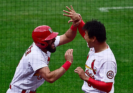 Apr 29, 2021; St. Louis, Missouri, USA;  St. Louis Cardinals pinch hitter Matt Carpenter (13) is congratulated by starting pitcher Kwang Hyun Kim (33) after hitting a three run home run during the fifth inning against the Philadelphia Phillies at Busch Stadium. Mandatory Credit: Jeff Curry-USA TODAY Sports