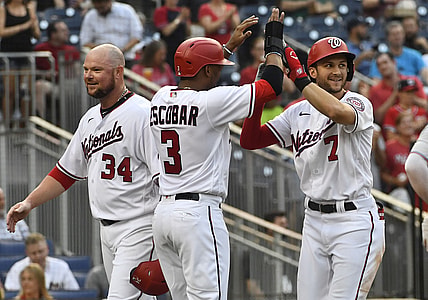 Jul 19, 2021; Washington, District of Columbia, USA; Washington Nationals shortstop Trea Turner (7) is congratulated by second baseman Alcides Escobar (3) after hitting a three run home run against the Miami Marlins during the second inning at Nationals Park. Mandatory Credit: Brad Mills-USA TODAY Sports