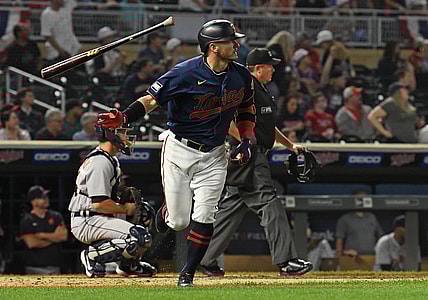 Sep 30, 2021; Minneapolis, Minnesota, USA;  Minnesota Twins infielder Josh Donaldson (20) flips his bat after hitting a three run home run off of Detroit Tigers starting pitcher Tarik Skubal (29) during the third inning at Target Field. Mandatory Credit: Nick Wosika-USA TODAY Sports