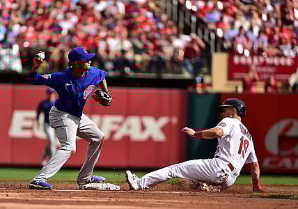 Oct 3, 2021; St. Louis, Missouri, USA;  Chicago Cubs shortstop Sergio Alcantara (51) turns a double play as St. Louis Cardinals second baseman Tommy Edman (19) slides during the third inning at Busch Stadium. Mandatory Credit: Jeff Curry-USA TODAY Sports