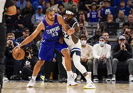 Nov 3, 2021; Minneapolis, Minnesota, USA;  Los Angeles Clippers forward Nicolas Batum (33) protects the ball from Minnesota Timberwolves guard Patrick Beverly (22) during the first quarter at Target Center. Mandatory Credit: Nick Wosika-USA TODAY Sports
