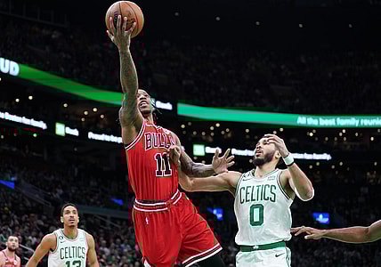 Jan 9, 2023; Boston, Massachusetts, USA; Chicago Bulls forward DeMar DeRozan (11) drives to the basket against Boston Celtics forward Jayson Tatum (0) in the first quarter at TD Garden. Mandatory Credit: David Butler II-USA TODAY Sports