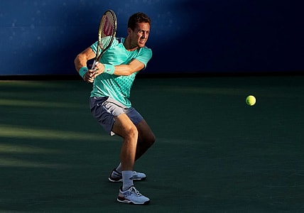 Sep 1, 2022; Flushing, NY, USA;  Roberto Carballes Baena of Spain hits a shot against Denis Shapovalov of Canada on day four of the 2022 U.S. Open tennis tournament at USTA Billie Jean King Tennis Center. Mandatory Credit: Jerry Lai-USA TODAY Sports
