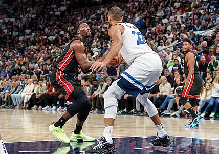 Oct 28, 2023; Minneapolis, Minnesota, USA; Miami Heat center Bam Adebayo (13) shoots the ball as Minnesota Timberwolves center Rudy Gobert (27) defends in the first quarter at Target Center. Mandatory Credit: Matt Blewett-USA TODAY Sports