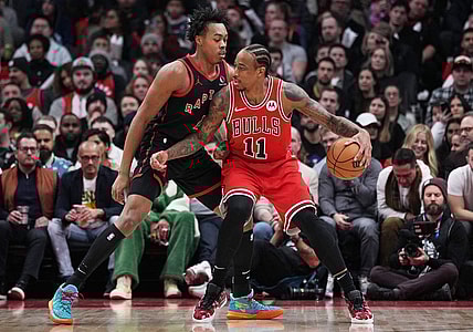 Jan 18, 2024; Toronto, Ontario, CAN; Chicago Bulls forward DeMar DeRozan (11) controls the ball as Toronto Raptors forward Scottie Barnes (4) tries to defend during the second quarter at Scotiabank Arena. Mandatory Credit: Nick Turchiaro-USA TODAY Sports