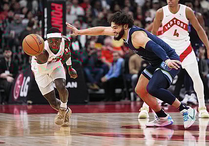 Jan 22, 2024; Toronto, Ontario, CAN; Toronto Raptors guard Dennis Schroder (17) battles for the ball with Memphis Grizzlies forward David Roddy (21) during the first quarter at Scotiabank Arena. Mandatory Credit: Nick Turchiaro-USA TODAY Sports