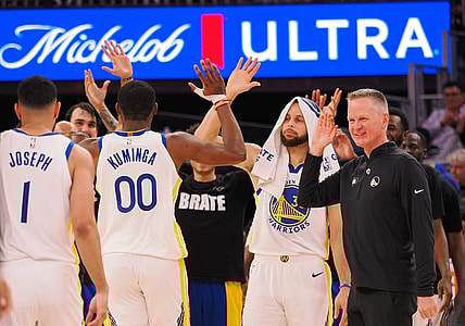 Jan 24, 2024; San Francisco, California, USA; Golden State Warriors forward Jonathan Kuminga (00) high fives guard Stephen Curry (30) and head coach Steve Kerr as a time out is called against the Atlanta Hawks during the fourth quarter at Chase Center. Mandatory Credit: Kelley L Cox-USA TODAY Sports