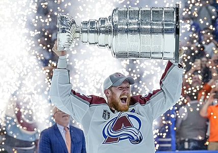 TAMPA, FL - JUNE 26: Colorado Avalanche left wing Gabriel Landeskog (92) Team Captain receives the Stanley Cup Trophy during the NHL Hockey Stanley Cup Finals Game six between Tampa Bay Lightning and the Colorado Avalanche on June 26th, 2022 at Amalie Arena in Tampa Florida (Photo by Andrew Bershaw /Icon_Sportswire)