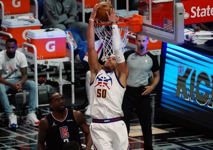 Apr 1, 2021; Los Angeles, California, USA; Denver Nuggets forward Aaron Gordon (50) dunks for a basket in front of Los Angeles Clippers forward Kawhi Leonard (2) during the first half at Staples Center. Mandatory Credit: Gary A. Vasquez-USA TODAY Sports
