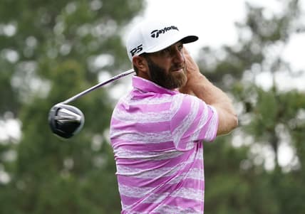 Apr 8, 2021; Augusta, Georgia, USA; Dustin Johnson hits his tee shot on the 18th hole during the first round of The Masters golf tournament. Mandatory Credit: Michael Madrid-USA TODAY Sports