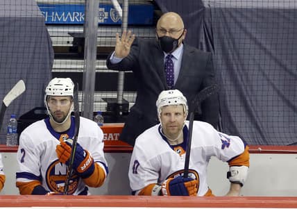 May 16, 2021; Pittsburgh, Pennsylvania, USA;  New York Islanders head coach Barry Trotz (top) asks for a four minute penalty against the  Pittsburgh Penguins during the second period in game one of the first round of the 2021 Stanley Cup Playoffs at PPG Paints Arena. New York won 4-3 in overtime.  Mandatory Credit: Charles LeClaire-USA TODAY Sports