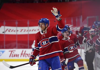 May 29, 2021; Montreal, Quebec, CAN; Montreal Canadiens forward Corey Perry (94) reacts with teammates including Cole Caufield (22) after scoring a goal against the Toronto Maple Leafs during the third period in game six of the first round of the 2021 Stanley Cup Playoffs at the Bell Centre. Mandatory Credit: Eric Bolte-USA TODAY Sports