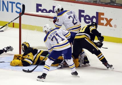 Oct 5, 2021; Pittsburgh, Pennsylvania, USA; Buffalo Sabres right wing Victor Olofsson (71) scores a goal against Pittsburgh Penguins goaltender Casey DeSmith (1) during the second period at PPG Paints Arena. Mandatory Credit: Charles LeClaire-USA TODAY Sports