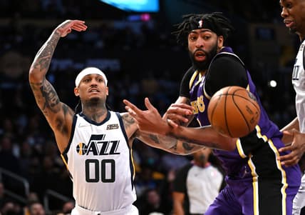 Feb 16, 2022; Los Angeles, California, USA; Los Angeles Lakers forward Anthony Davis (3) and Utah Jazz guard Jordan Clarkson (00) go for the ball in the first half at Crypto.com Arena. Mandatory Credit: Jayne Kamin-Oncea-USA TODAY Sports