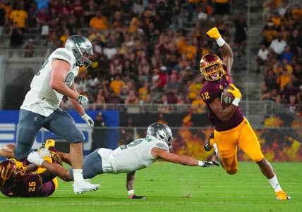 September 17, 2022; Tempe, Arizona; USA; Arizona State Sun Devils defensive back Kejuan Markham (12) returns an interception against the Eastern Michigan Eagles during a game at Sun Devil Stadium. Mandatory Credit: Patrick Breen-USA TODAY Sports