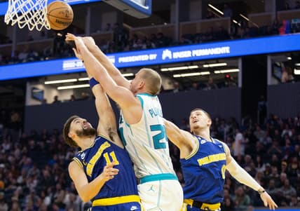 Dec 27, 2022; San Francisco, California, USA; Charlotte Hornets forward Mason Plumlee (24) knocks away a rebound between Golden State Warriors guards Klay Thompson (11) and Donte DiVincenzo (0) during the second quarter at Chase Center. Mandatory Credit: D. Ross Cameron-USA TODAY Sports