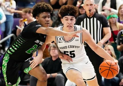 Mar 3, 2022; Phoenix, Arizona, USA; Utah Valley Wolverines guard Justin Harmon (24) pressures Grand Canyon Antelopes guard Walter Ellis (55) at GCU Arena. Mandatory Credit: Rob Schumacher-Arizona Republic

Ncaa Basketball Utah Valley At Grand Canyon