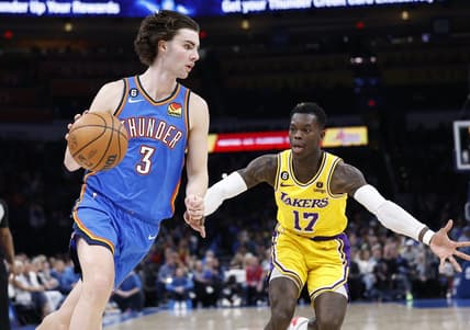 Mar 1, 2023; Oklahoma City, Oklahoma, USA; Oklahoma City Thunder guard Josh Giddey (3) dribbles the ball around Los Angeles Lakers guard Dennis Schroder (17) during the second quarter at Paycom Center. Mandatory Credit: Alonzo Adams-USA TODAY Sports